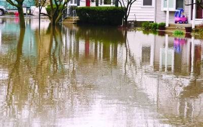 Reflections on flood waters over a suburban street in springtime, northern Illinois